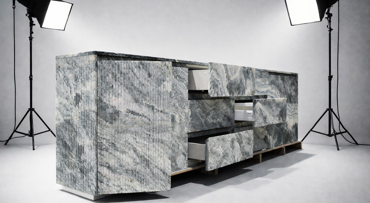 Sculptural marble cabinet photographed in a studio
